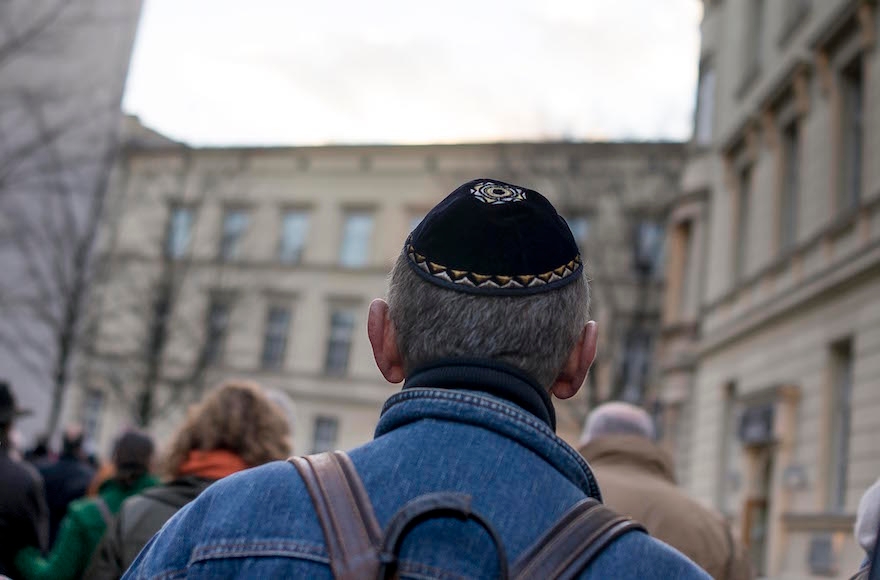 A man wears a kippah as he takes part in a silent march to commemorate the 75th anniversary of the Kristallnacht pogroms on November 9, 2013 in Berlin, Germany. (Carsten Koall/Getty Images)