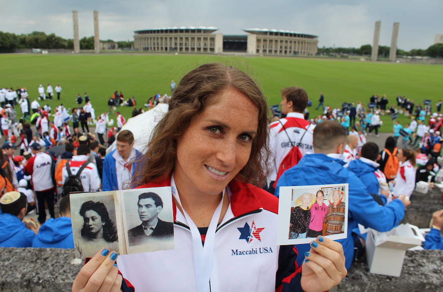 Catie Chase showing photos of her late grandparents, who survived the Holocaust. (Hillel Kutler)