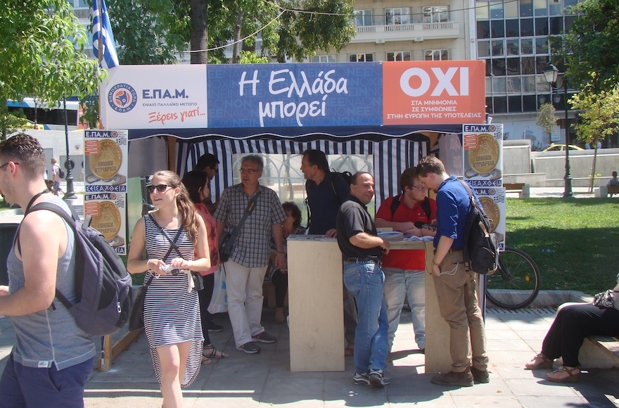 Workers set up a stage for a "No" protest to be held in central Athens on Thursday. (Gavin Rabinowitz)
