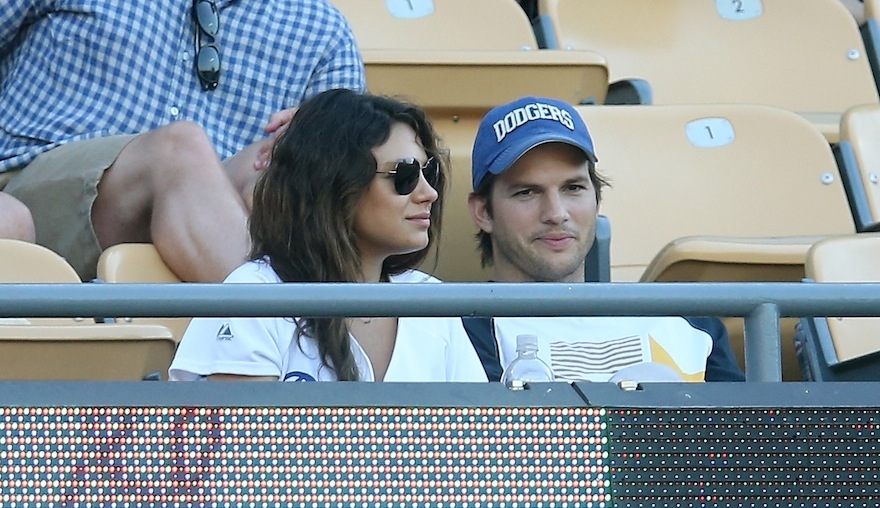 Actors Mila Kunis and Ashton Kutcher at Dodger Stadium on June 28, 2014 in Los Angeles, California. (Stephen Dunn/Getty Images)