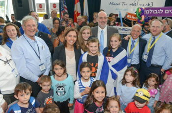 From right to left: Nefesh B'Nefesh co-founder and Orthodox rabbi Yehoshua Fass, Nefesh B'Nefesh co-founder Tony Gelbart, Israel's Ambassador to the U.N. Ron Prosor and Israel's Minister for Senior Citizens Gila Gamliel at JFK airport in New York on Monday, July 13, 2015. (Courtesy: Shahar Azran/Nefesh B'Nefesh)