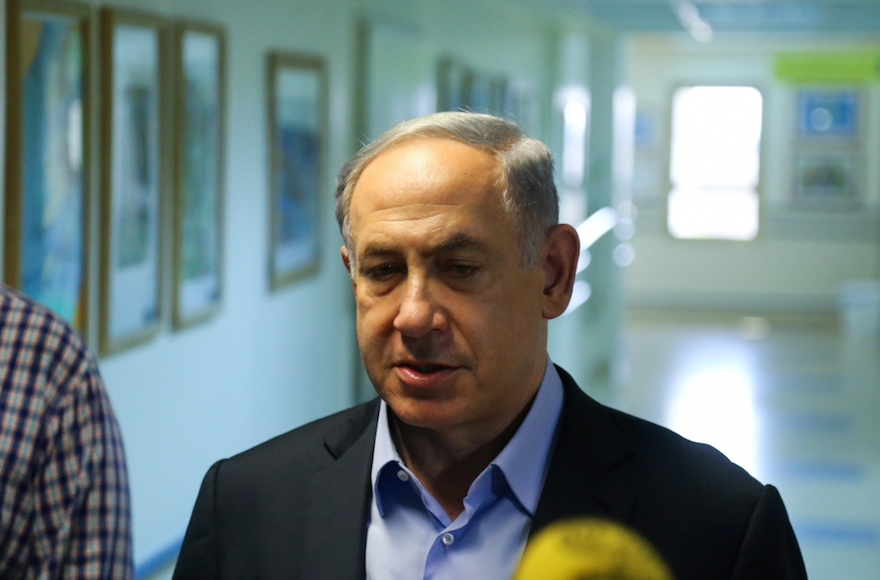 Israeli Prime Minister Benjamin Netanyahu visiting the hospitalized family of a West Bank Palestinian baby killed in an arson attack, July 31, 2015.