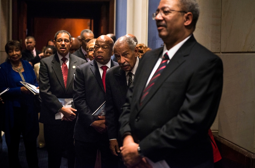 Rep. John Lewis, D-Ga., second from right, with other members of the Congressional Black Caucus before a ceremony at the U.S. Capitol, Jan. 6, 2015. (Gabriella Demczuk/Getty Images)
