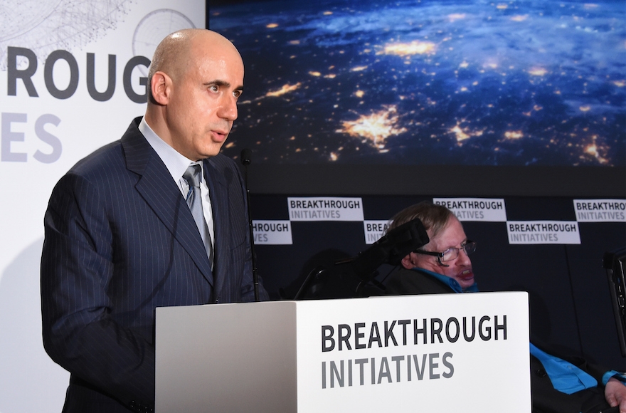 Yuri Milner, left, and Stephen Hawking attending a press conference on the Breakthrough Life in the Universe Initiatives, July 20, 2015, in London, England. (Stuart C. Wilson/Getty Images)