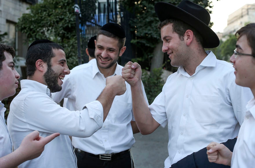 Young ultra orthodox Jewish men during a break from studying at the Yeshiva Ateret Israel, in Jerusalem on September 2, 2013. (Nati Shohat/Flash90)