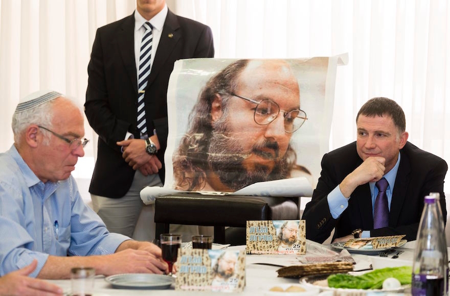 Chairman of the Knesset, Yuli Edelstein, right, and Israel's Minister of Housing, Uri Ariel, far left, at a Passover Seder meal held in honor of Jonathan Pollard at the Knesset on April 8, 2014. (Flash90).