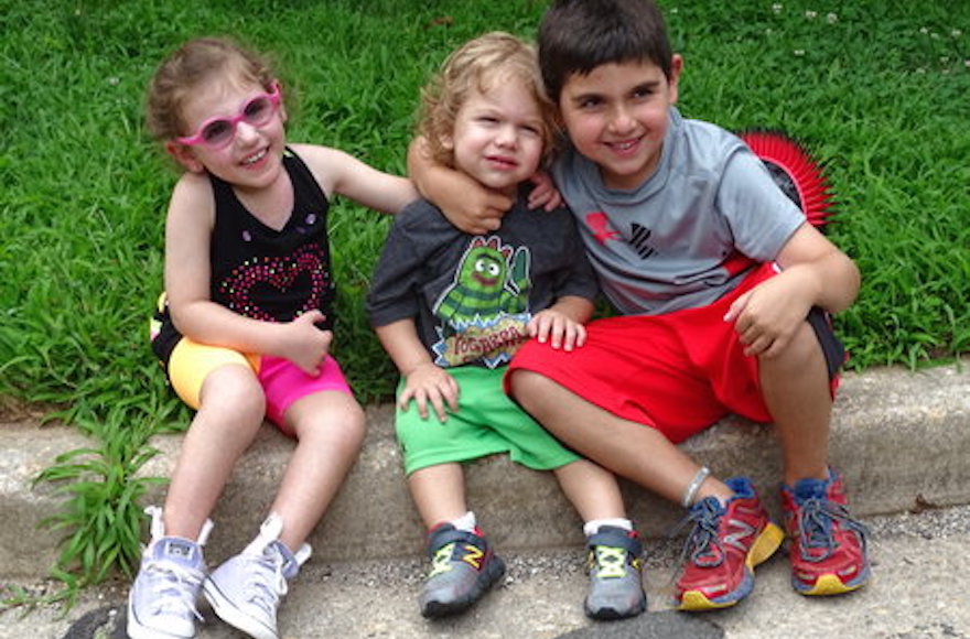 From left to right: Jamison, Grayson and Jackson Eberstein, taking a break from playing. (Suzanne Pollak/Washington Jewish Week)