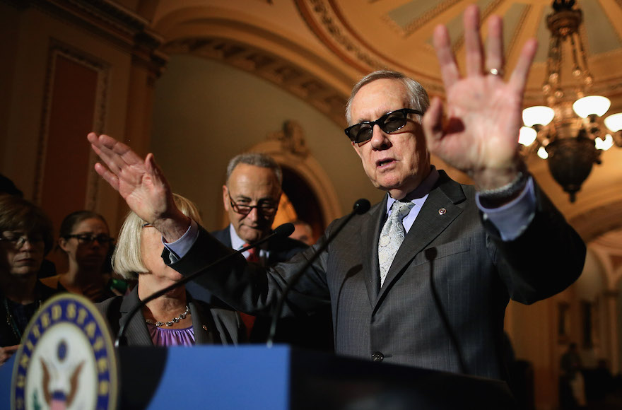 Harry Reid, D-Nev., talking with reporters with Sen. Charles Schumer, D-N.Y., at the U.S. Capitol, August 4, 2015, in Washington, D.C. (Chip Somodevilla/Getty Images)