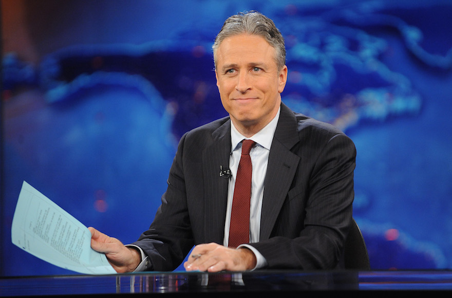 This Nov. 30, 2011 file photo shows television host Jon Stewart during a taping of 