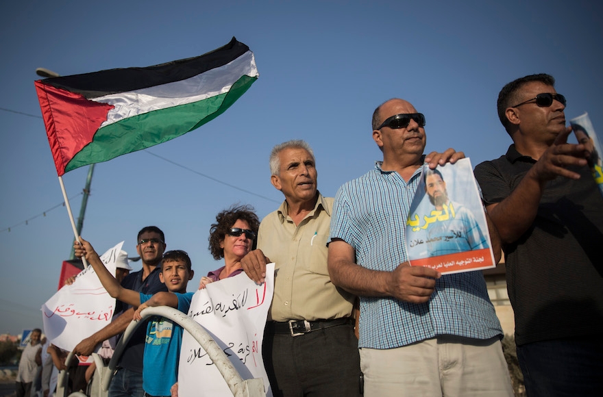 Palestinians demonstrating for the release of then-imprisoned Mohammed Allaan, who staged a 65-day hunger strike in an Israeli jail, in the Bedouin city of Rahat in southern Israel on August 18, 2015. (Hadas Parush/Flash90)