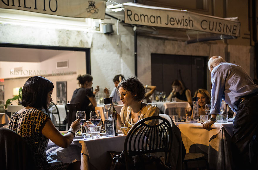 People eating in a Jewish restaurant in the Ghetto district during the opening of the International Festival of Jewish Culture and Literature on July 20, 2013, in Rome, Italy. The International Festival of Jewish Culture will take place July 20 to 25. (Giorgio Cosulich/Getty Images)