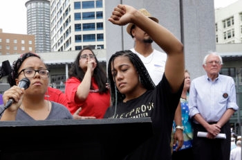 Marissa Johnson, left, Mara Jacqueline Willaford taking over the microphone at a Bernie Sanders rally in Seattle on August 8, 2015. (Elaine Thompson/AP Images)