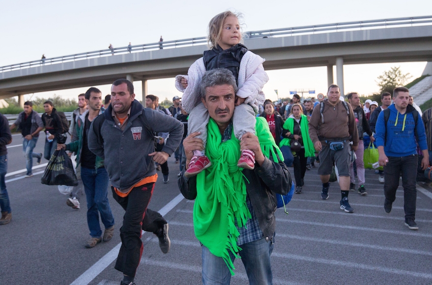 Migrants walking along a motorway near the southern Hungarian village of Roszke, Sept. 7, 2015. (Matt Cardy/Getty Images)