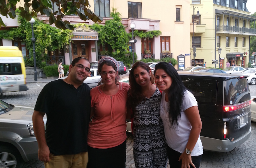 Liad Shemesh, an Israeli tourist, standing outside the Great Synagogue of Tbilisi with his wife, Einat, Adi Amram and Ortal Panehla on Aug. 20, 2015. (Cnaan Lipshiz)