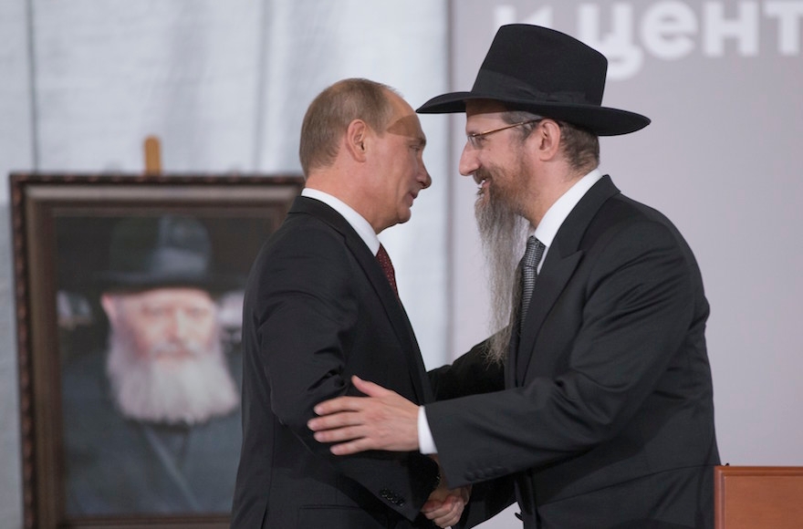 Russian President Vladimir Putin, left, is greeted by Russia's Chief Rabbi Berel Lazar in Moscow, June 13, 2013. (Alexander Zemlianichenko/AP Images)