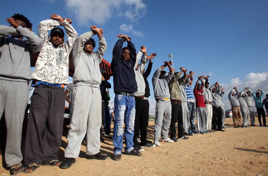 African migrants protesting outside the Holot detention center near Ktsiot, in the Negev Desert, southern Israel on February 17, 2014. (Flash90)