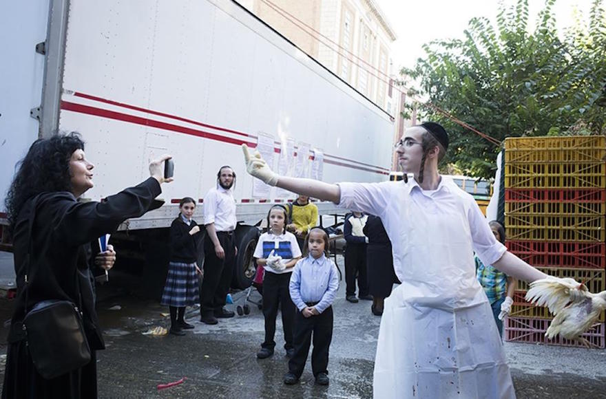 A Hasidic man expressing himself to an anti-kapparot activist in Brooklyn, New York, Sept. 17, 2015.