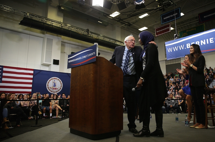 Democratic presidential candidate Sen. Bernie Sanders, I-Vt., hugging Muslim student Remaz Abdelgader during a 
