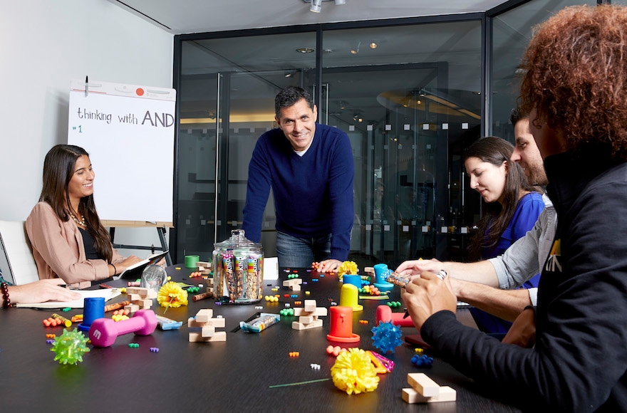 Daniel Lubetzky, CEO and founder of KIND snacks, with members of the KIND team at the company's New York City headquarters. (Poon Watchara-Amhaiwan)