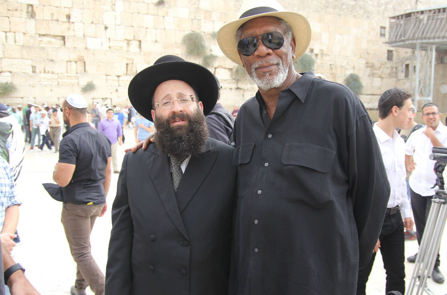 Morgan Freeman meets with Rabbi of the Western Wall Shmuel Rabinowitz during a visit to the religious site. 