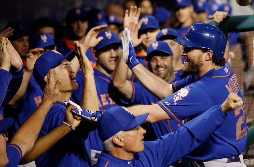 New York Mets' second baseman Daniel Murphy celebrating with teammates after hitting a home run against the Philadelphia Phillies in Philadelphia on Sept. 30, 2015. (Matt Slocum/AP Images)