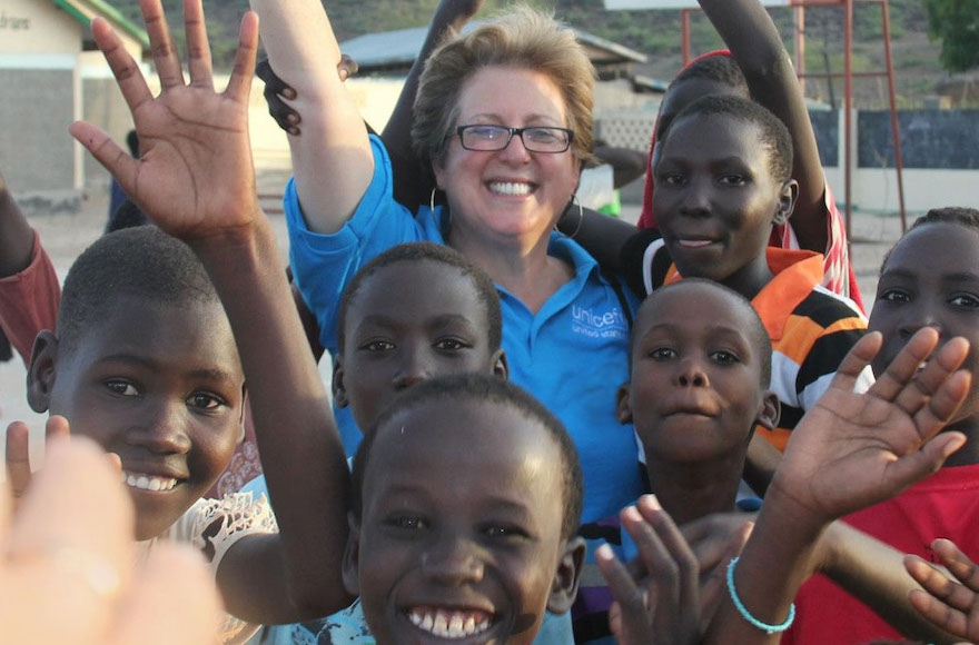 U.S. Fund for UNICEF President and CEO Caryl Stern waves with children in Lodwar, Kenya. (Courtesy of the U.S. Fund for UNICEF) 