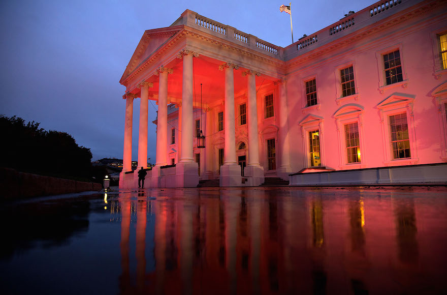 The North Portico of the White House is illuminated pink in honor of Breast Cancer Awareness Month, Oct. 15, 2014. (Official White House Photo by Chuck Kennedy)