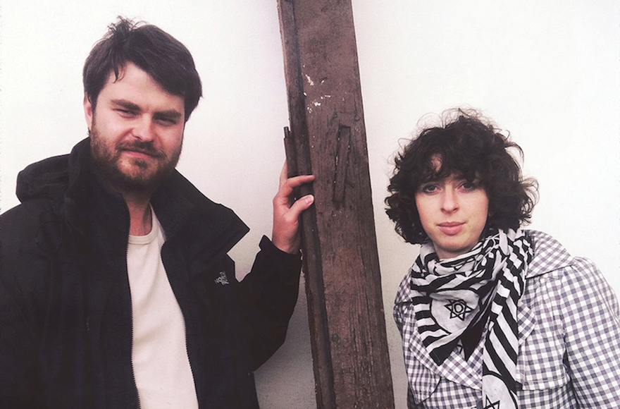 Helena Czernek, right, and Aleksander Prugar with the remains of a mezuzah they will use to create a new piece of Judaica. (Katarzyna Markusz) 