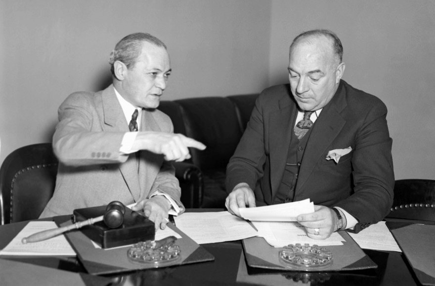 Chairman Samuel Dickstein, left, of the House Immigration Committee, discussing the bill of Rep. William Schulte, D-Ind., to restrict immigration into the United States from Mexico, March 7, 1934. (AP Images)