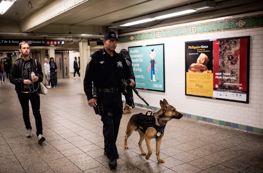 A police officer patrolling the Times Square subway stop in New York City the day after a series of terrorist attacks occurred in Paris, Nov. 14, 2015. (Andrew Renneisen/Getty Images)