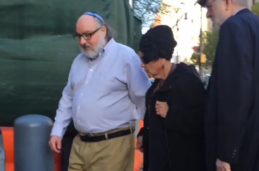 Jonathan Pollard, left, arrives at a federal courthouse in New York with his wife, Esther, to check in at a probation office just hours after he was released from prison, Nov. 20, 2015. (Ilana Gold/WCBS-TV via AP Images)