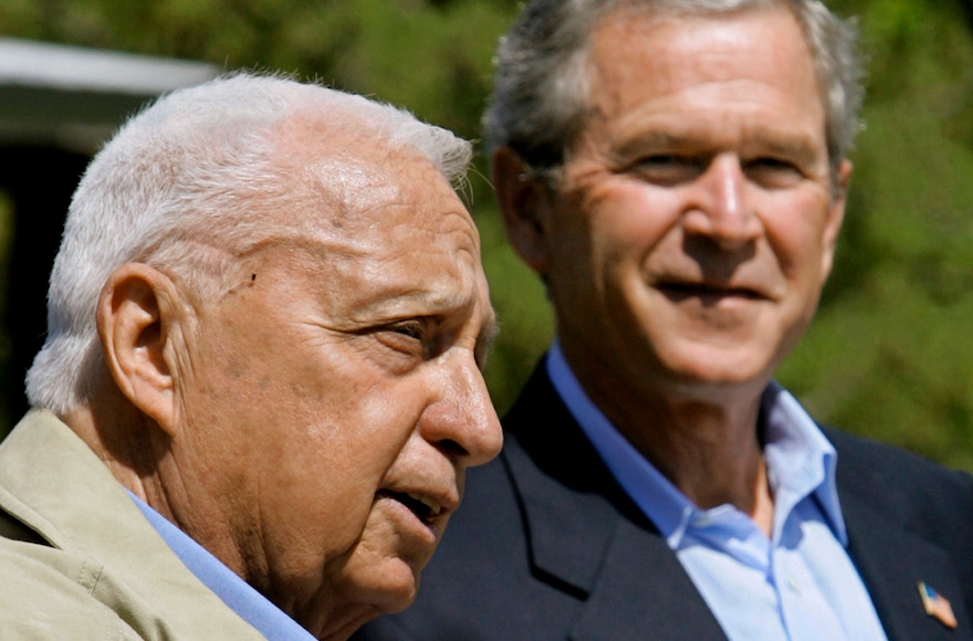 U.S. President George W. Bush listening to Israeli Prime Minister Ariel Sharon, left, speaking at a joint news conference following their talks about the Middle East peace process at Bush's ranch in Crawford, Texas, April 11, 2005. (J. Scott Applewhite/AP Images)
