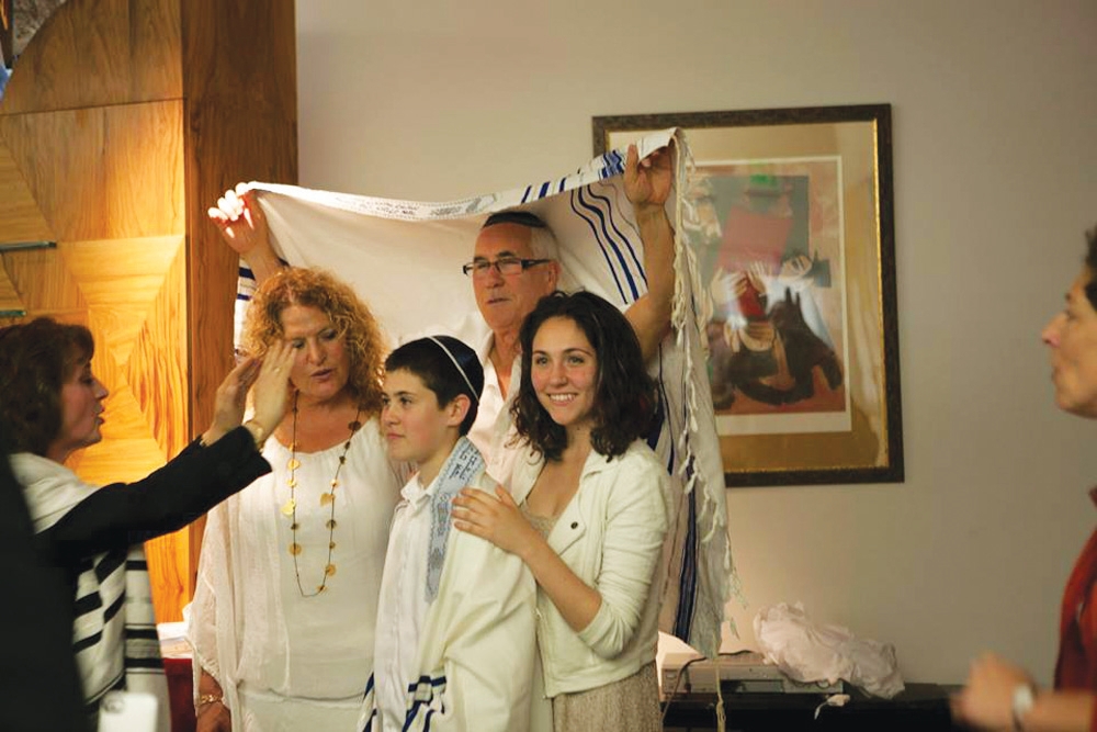 Rabbi Tsipi Gabai blessing newly named transgender teen Tom Sosnik at Tehiyah Day School in El Cerrito, Calif., March 13, 2015. (Misha Bruk)