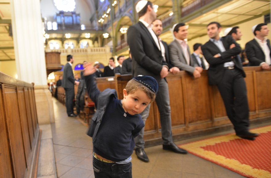 A young wedding guest at a marriage ceremony at Paris's Syangogue des Tounelles, Nov. 15, 2015. (Alain Azria)