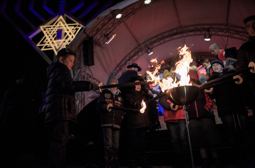 Children celebrating at the Brandenburg Gate in Berlin, Dec. 6, 2015. (Carsten Koall/Getty Images)