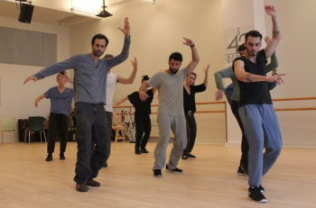 Choreographer Hofesh Shechter, left, with "Fiddler" cast members at New West 42nd Street Studios. (Lindsay Hoffman/Jeffrey Richards Associates)