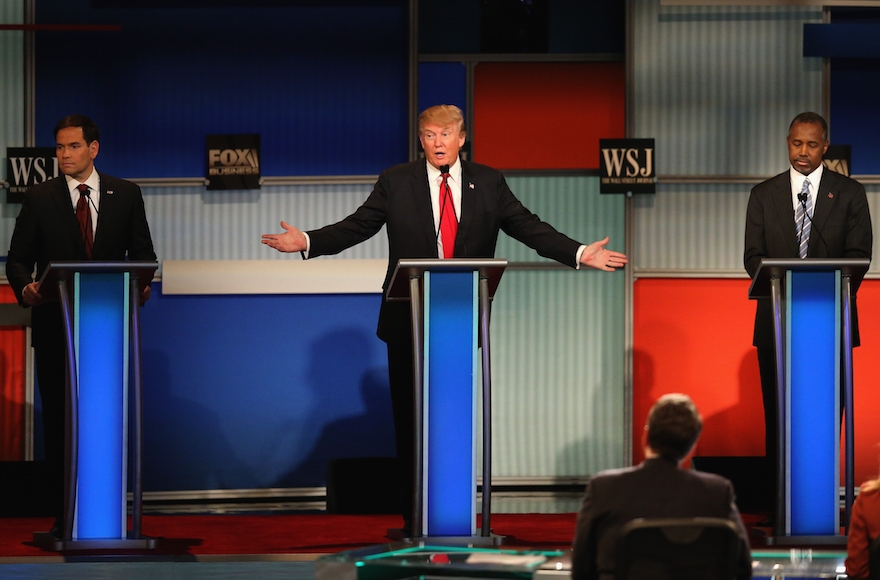 Presidential candidate Donald Trump, center, speaking while Sen. Marco Rubio, left, R-Fl., and Ben Carson look on during the Republican Presidential Debate sponsored by Fox Business and the Wall Street Journal at the Milwaukee Theatre in Milwaukee, Wisconsin, Nov. 10, 2015. (Scott Olson/Getty Images)