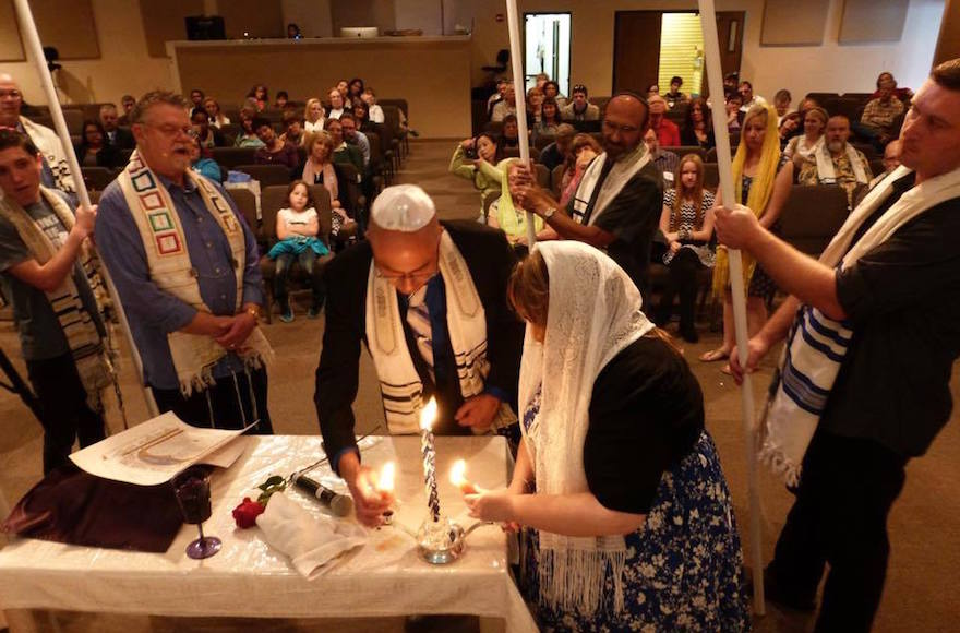 Nicholas Thalasinos renewing his marital vows with his wife at a Jewish-style ceremony, 2013. (Facebook) 