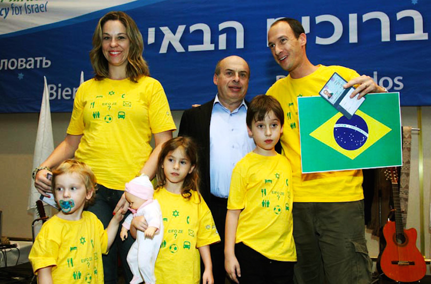 The Teitelbaum family is welcomed to Israel by by Jewish Agency Chairman Natan Sharansky in 2010. (Teitelbaum family)