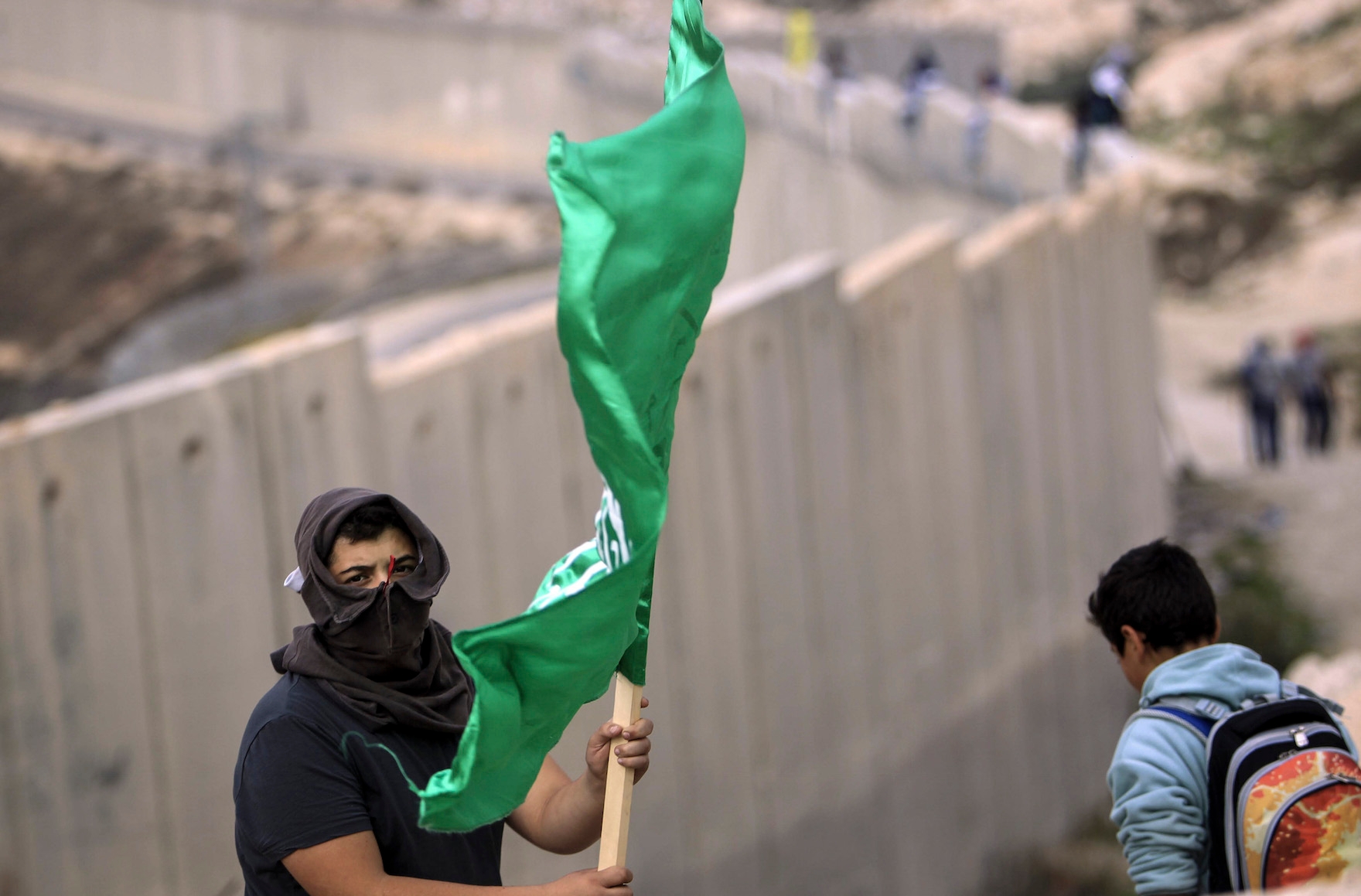 Palestinian protesting at the West Bank separation barrier, Nov. 16, 2015. (Muammar Awad/FLASH90)