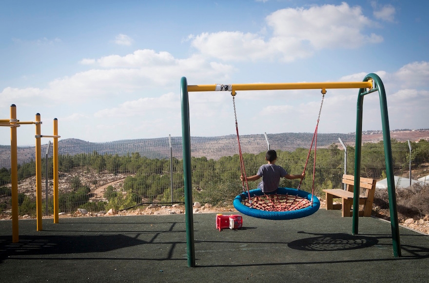 Children playing in the streets of the settlement of Gevaot, Sept. 2, 2014. (Miriam Alster/Flash90)