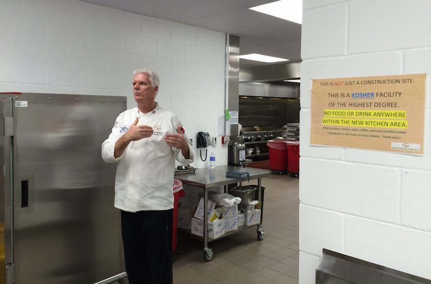 Executive Chef Michael McMullen of the Rosen Plaza explains the special kosher safeguards at the hotel's new $2 million kosher kitchen. (Uriel Heilman)