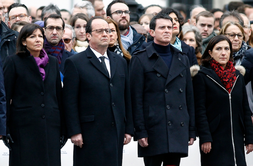 Prime Minister Manuel Valls, third from left. paying respect during a ceremony held for the victims of terrorist attacks at Place de la Republique in Paris, France, Jan, 10, 2016.. (Thierry Chesnot/Getty Images)