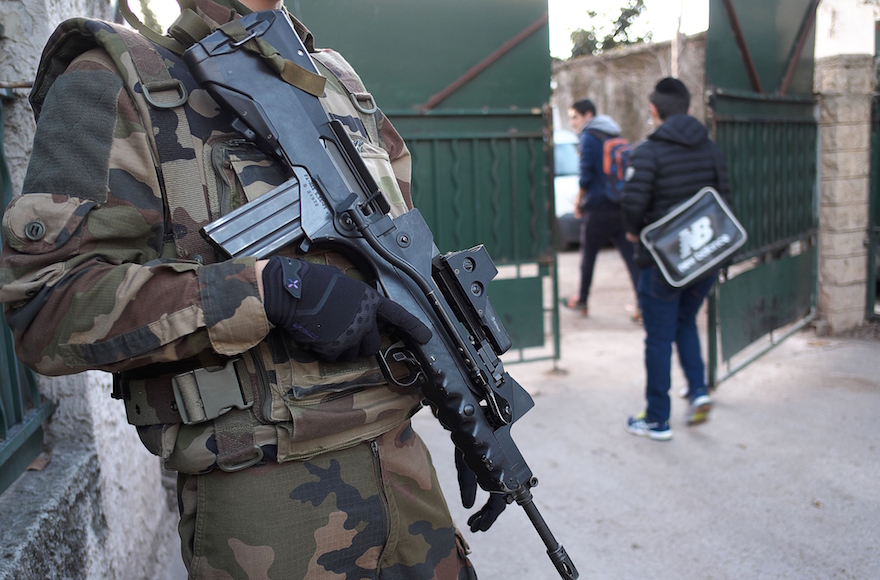 An armed French soldier securing the access to the La Source Jewish school in Marseille, southern France a day after a teenager, armed with a machete and a knife, wounded a teacher slightly before being stopped and arrested, Jan. 12, 2016. (Boris Horvat/AFP/Getty Images) 