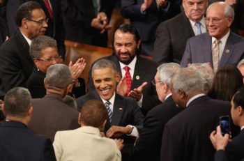 President Barack Obama shaking hands with members of Congress as he arrives to deliver his State of the Union speech in the House of Representatives in Washington, D.C., Jan. 12, 2016. (Mark Wilson/Getty Images)