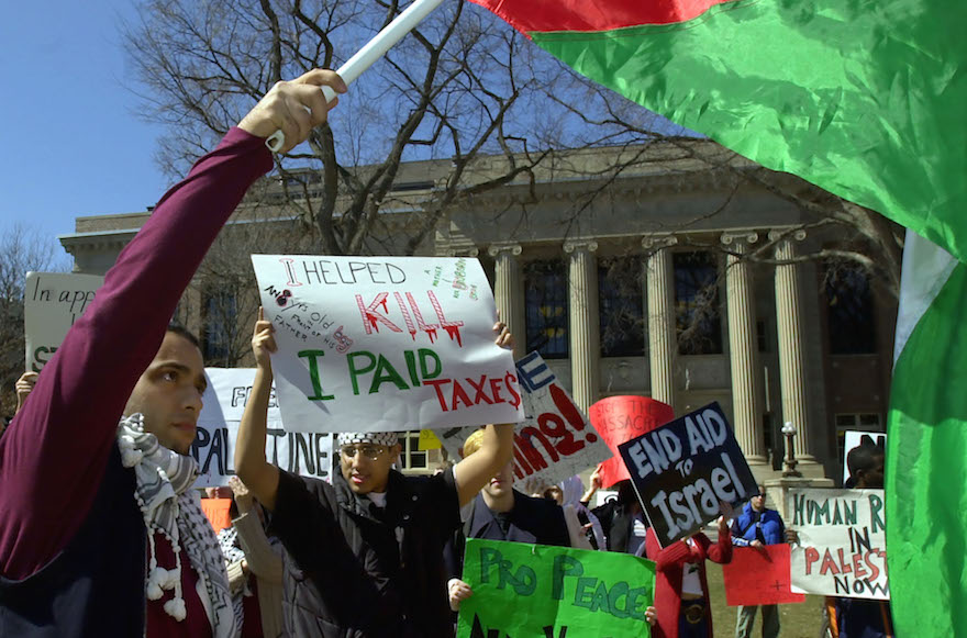 Students at the University of Minnesota waving a Palestinian flag during a protest at the school’s Minneapolis campus. (AP Photo/Ann Heisenfelt)