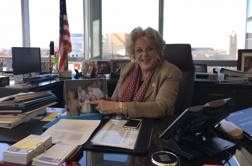 Carolyn Goodman, the mayor of Las Vegas, poses with a photo of her family in her office, Feb. 10, 2016. (Ron Kampeas)