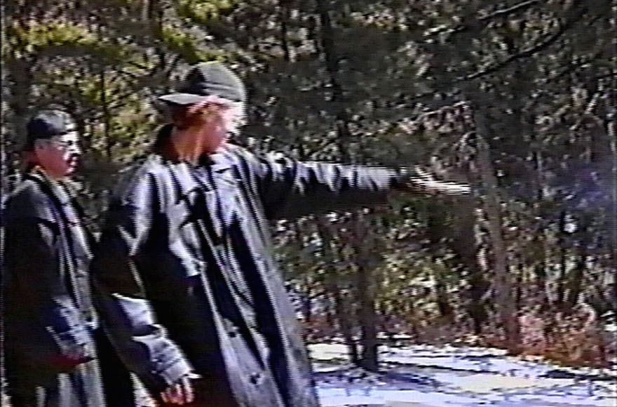 Eric Harris, left, watching as Dylan Klebold practices shooting a gun at a makeshift shooting range in Douglas County, Colorado, March 6, 1999. (Jefferson County Sheriff's Department via Getty Images)