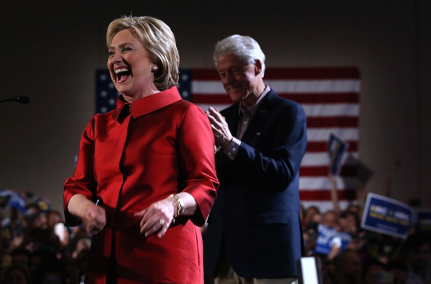 Hillary Clinton greeting supporters at a caucus day event as her husband, former President Bill Clinton, looks on at Caesars Palace in Las Vegas, Nevada, Feb. 20, 2016. (Justin Sullivan/Getty Images)