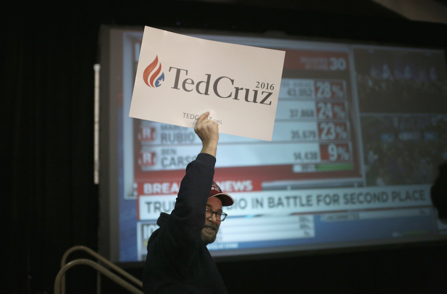 People cheering as Republican presidential candidate Sen. Ted Cruz. R-Tx.) is declared the winner at the caucus night gathering at the Iowa State Fairgrounds on in Des Moines, Iowa. (Christopher Furlong/Getty Images)